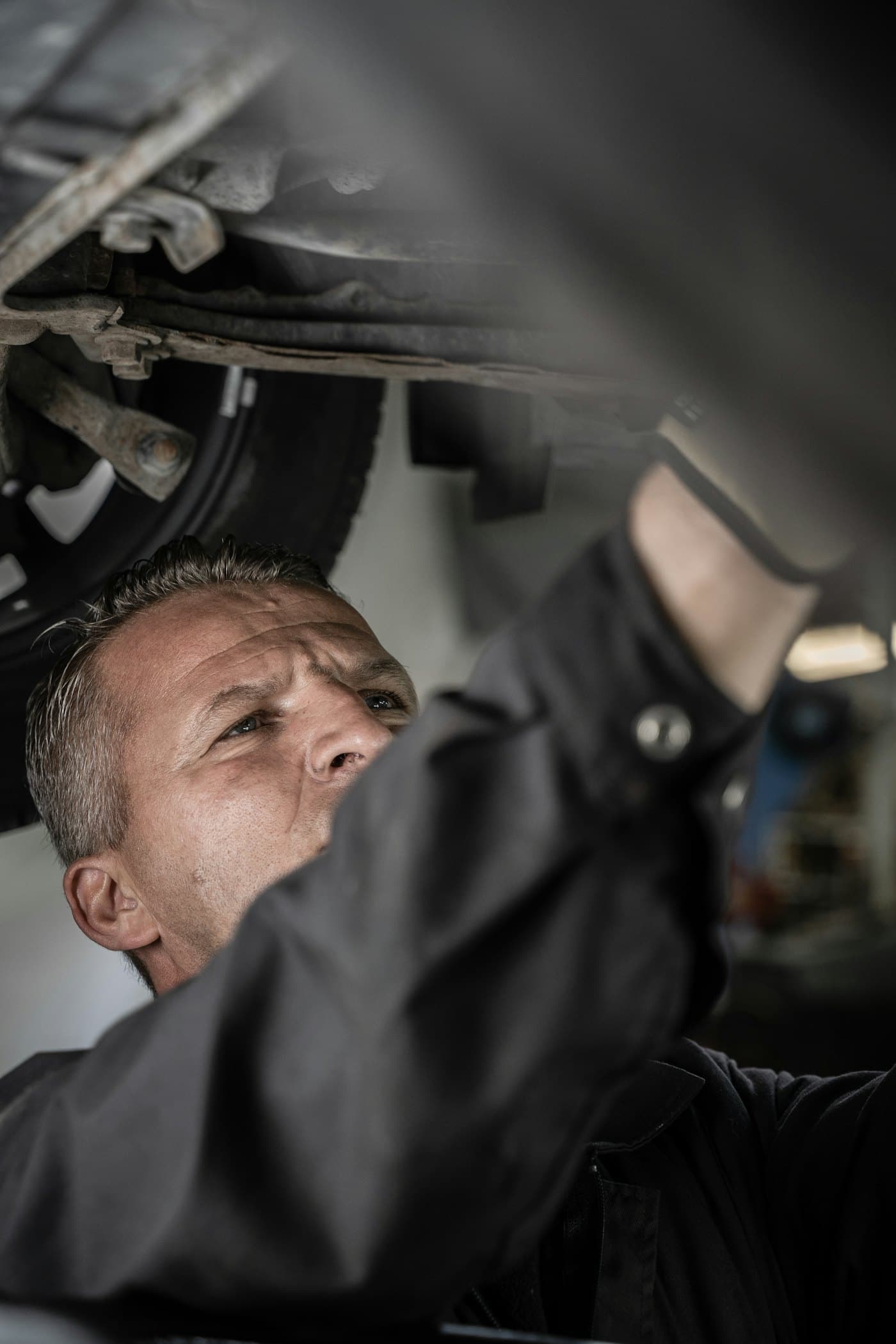A mechanic working under a car